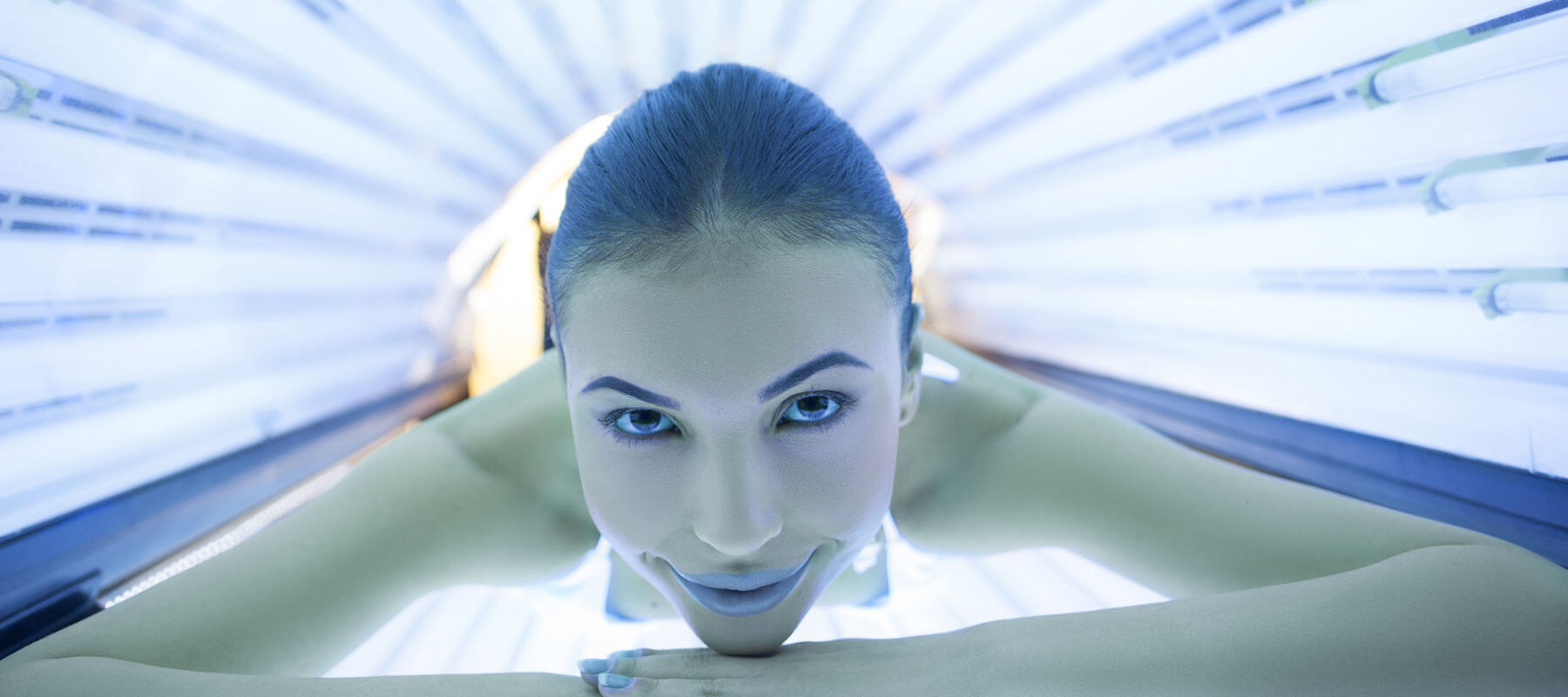 Woman in tanning bed