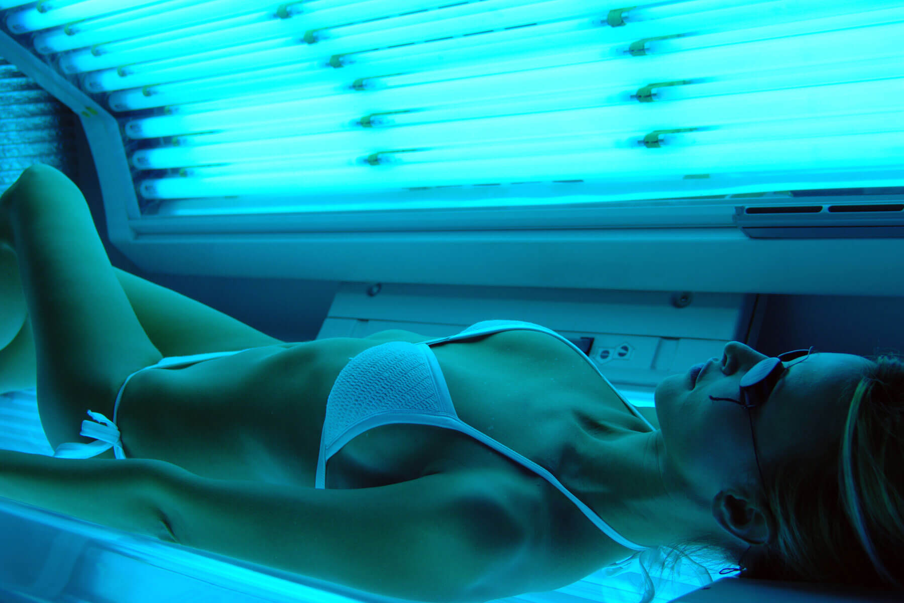 Woman In Tanning Bed